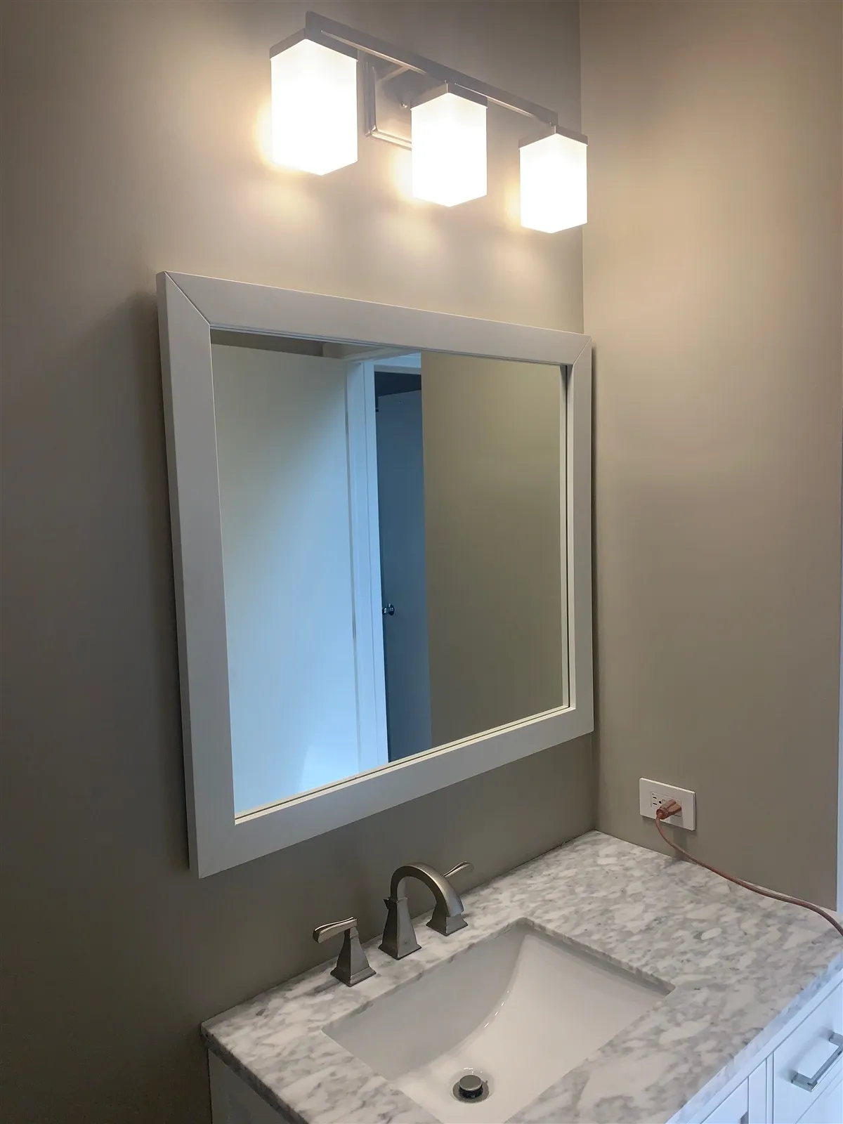 Bathroom vanity with mirror and vanity light