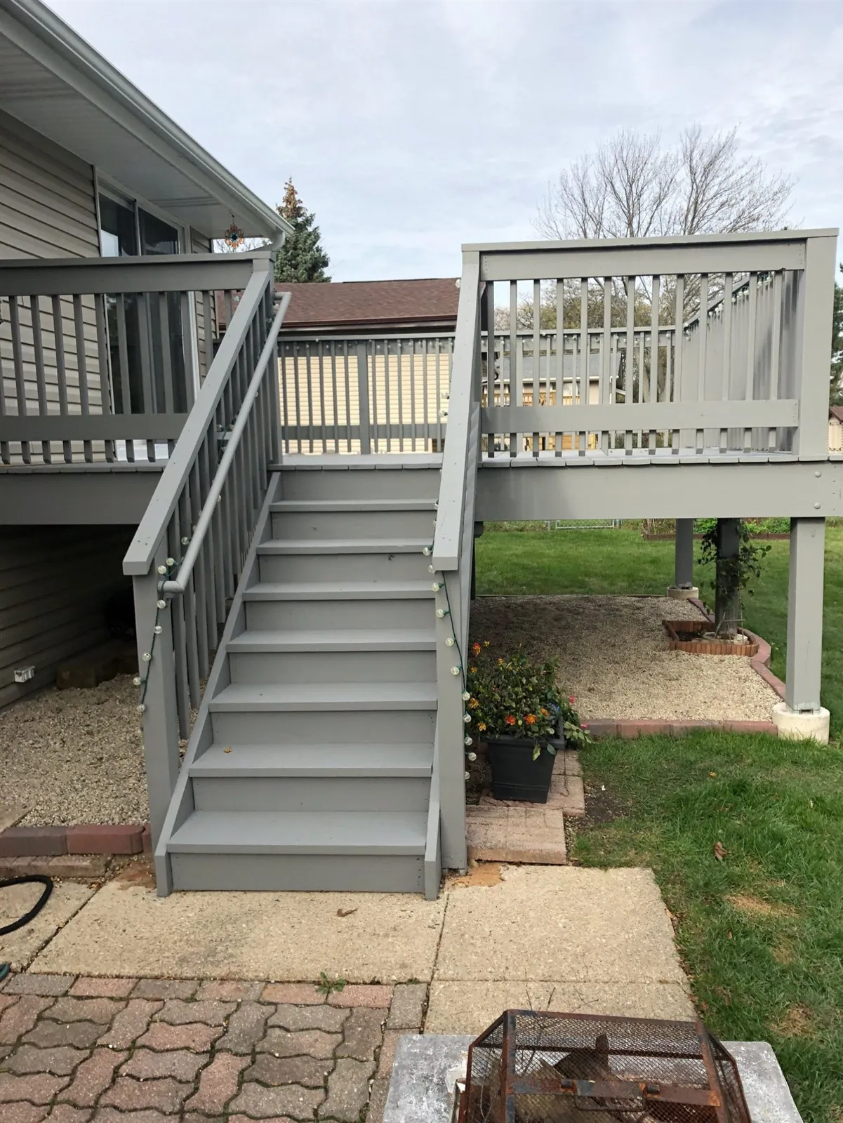 Raised wood deck with stairs and railings