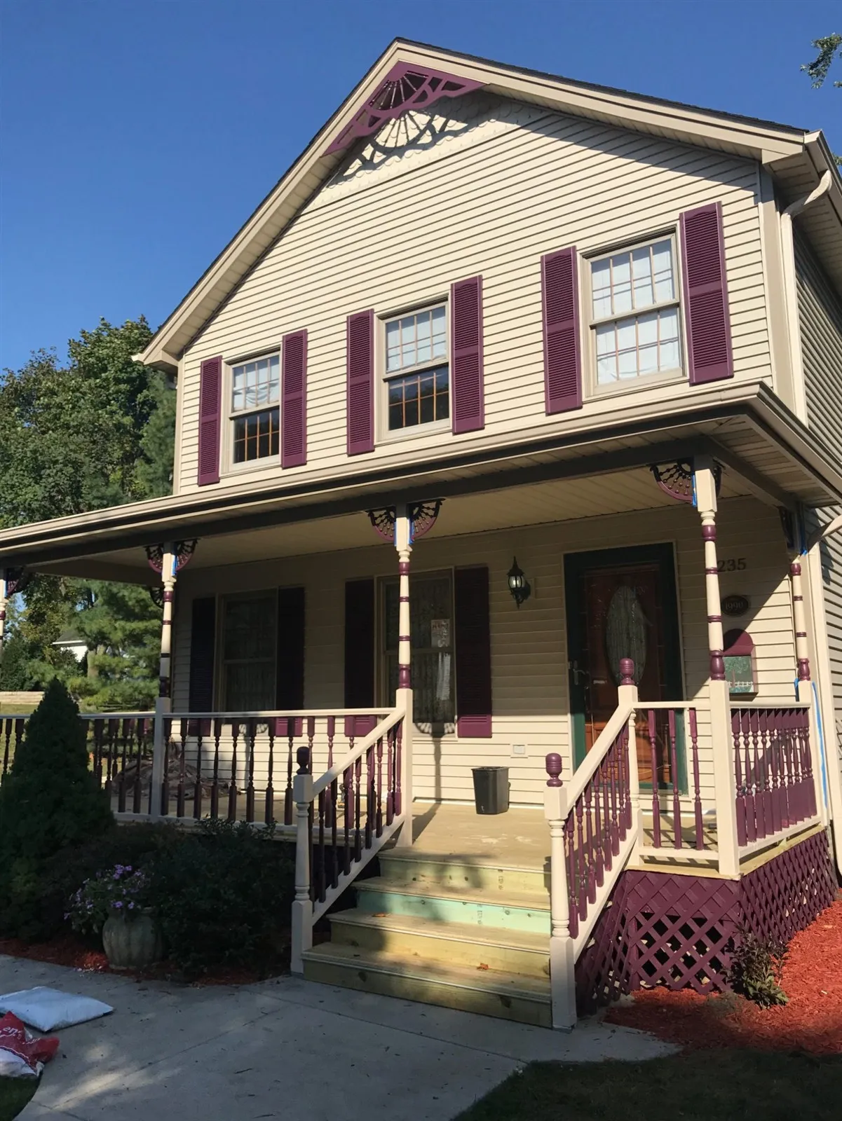 House with a renovated front porch, new railings and stairs