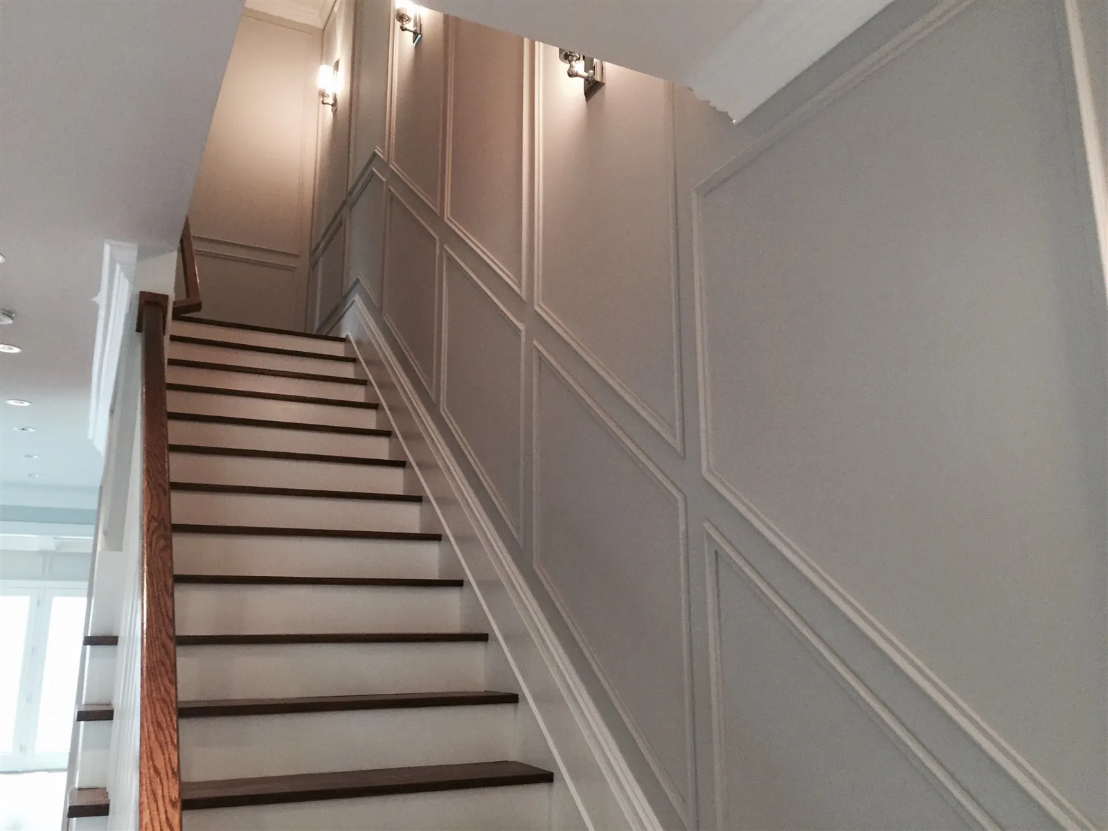 Staircase with new wainscoting and wood treads