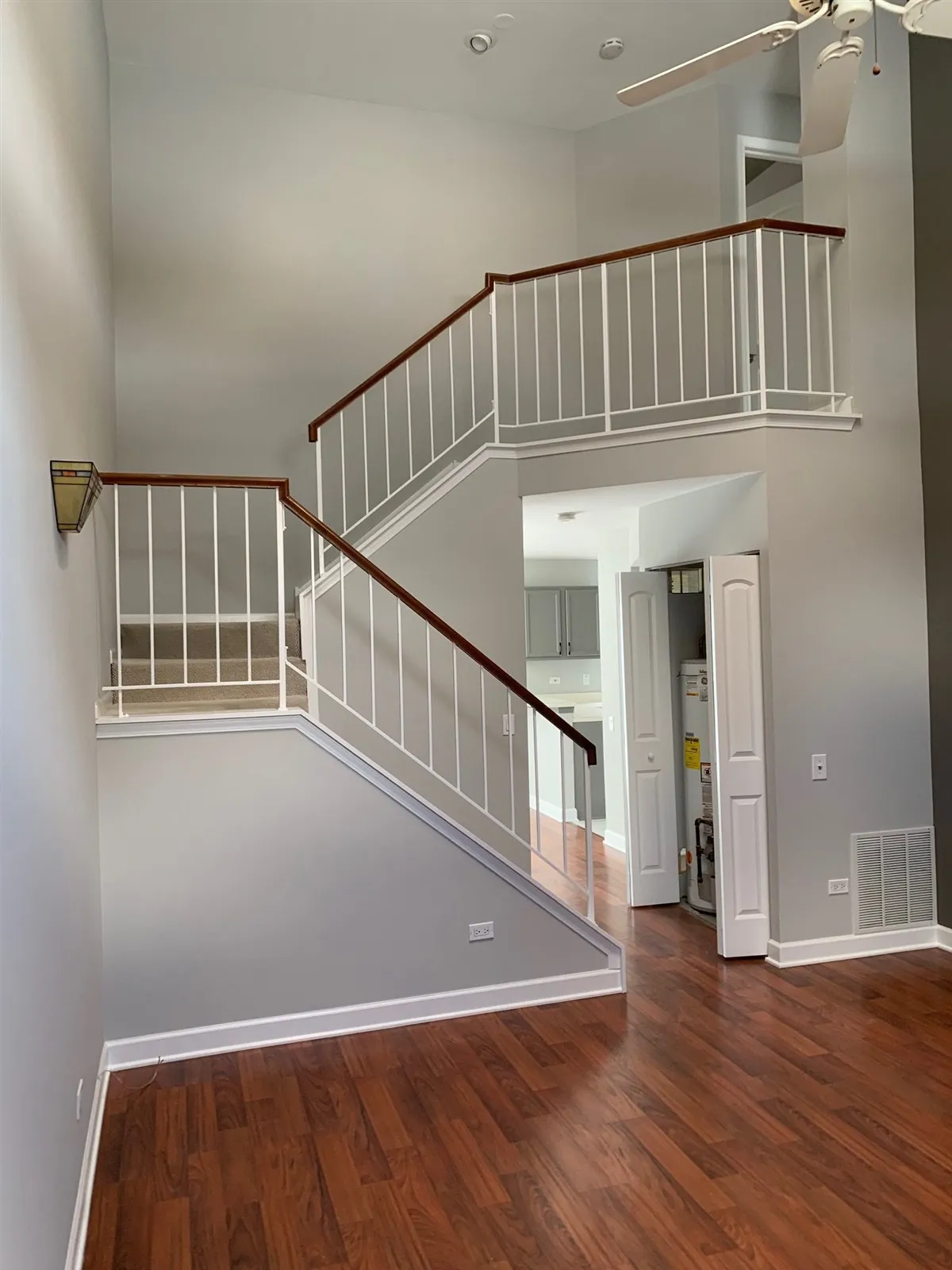 Staircase with a new hardwood floor at the bottom