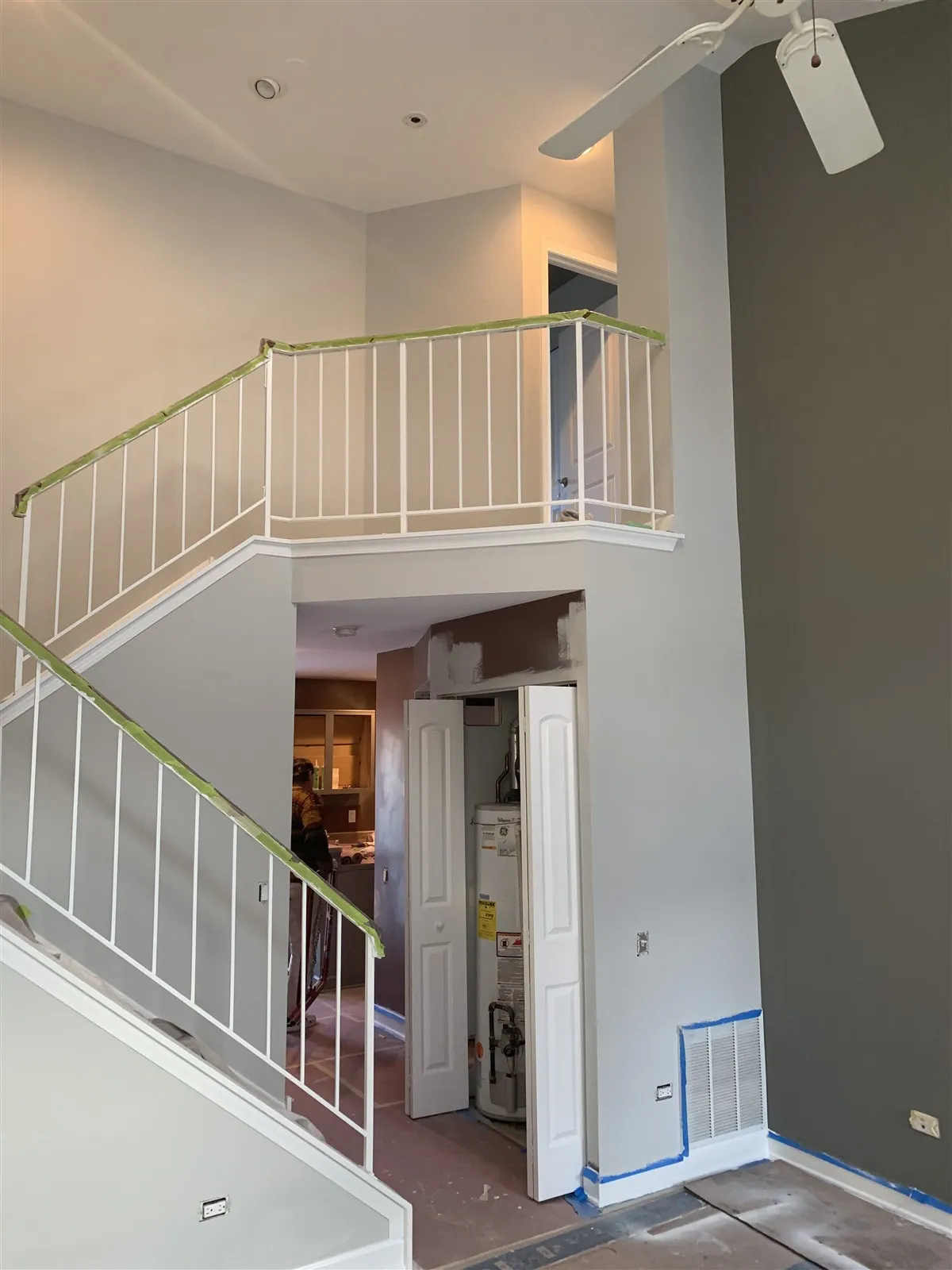 Two-story foyer with a staircase and railings